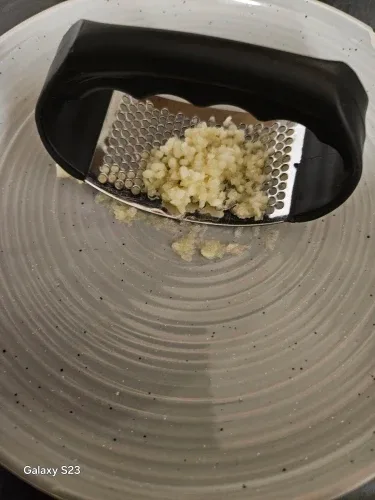 Presse-ail inox dans son emballage à la réception — photo d'un acheteur vérifié
